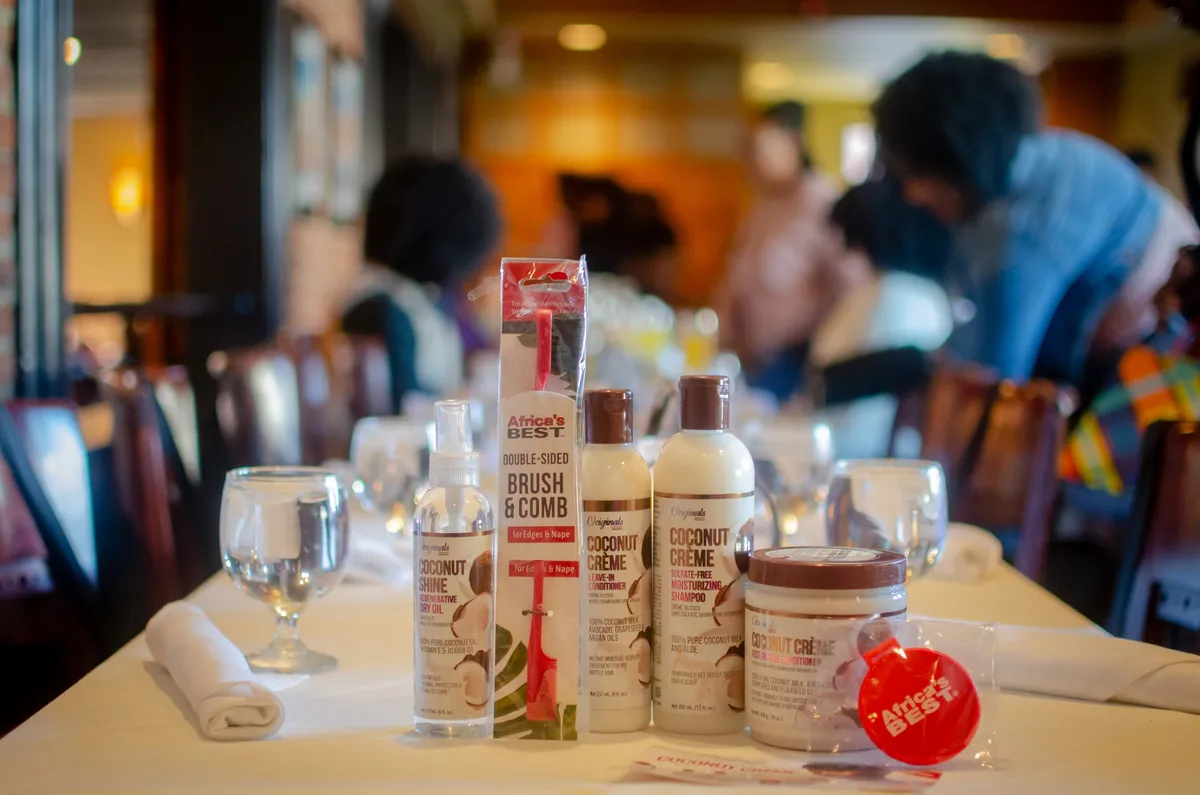 Natural hair care products arranged on a white brunch table